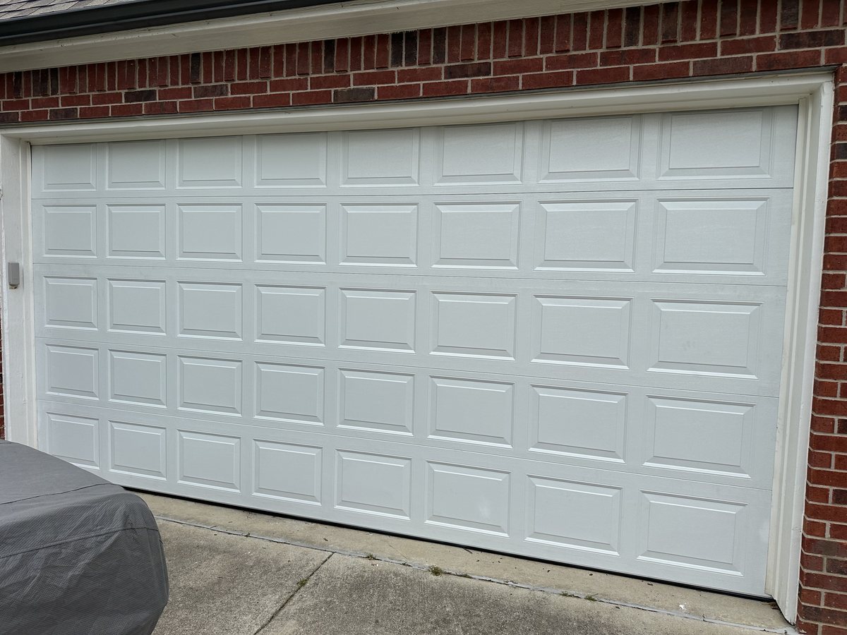 Residential garage door ready for emergency repair service